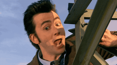 Man In Suit Making Funny Face With Mouth Open GIF