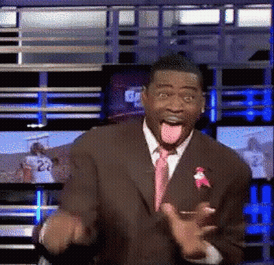 Man In Suit Making Funny Face With Tongue Out GIF