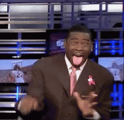 Man In Suit Making Funny Face With Tongue Out GIF