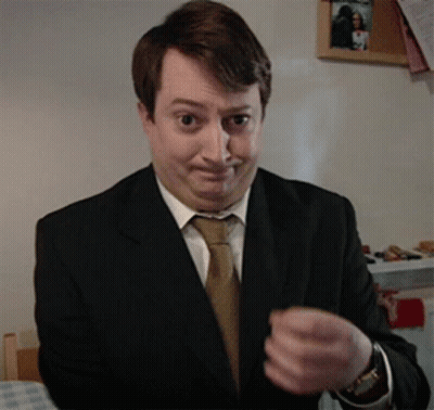 Man In Suit Making Funny Face GIF