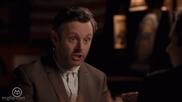 Man In Suit Making Gesture GIF