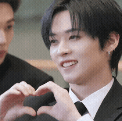 Man In Suit Making Heart With Hands GIF