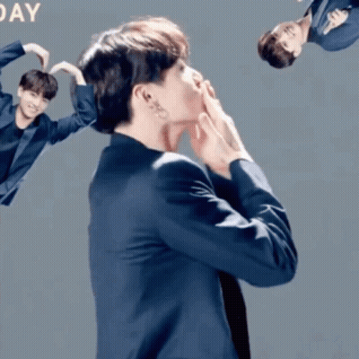 Man In Suit Making Heart With Hands Saying Day GIF