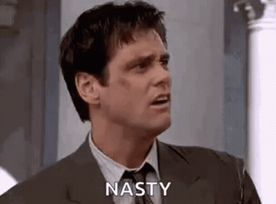 Man In Suit Making Nasty Face GIF