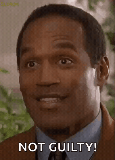Man In Suit Making Not Guilty Face GIF