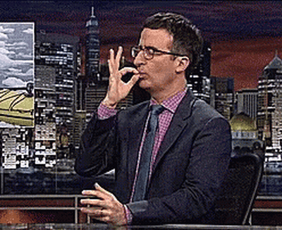 Man In Suit Making OK Sign At Desk GIF