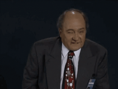 Man In Suit Making Rude Gesture GIF