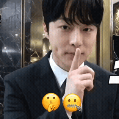 Man In Suit Making Shhh Gesture GIF
