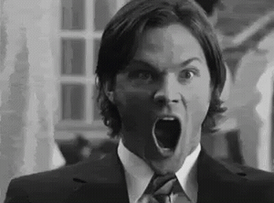 Man In Suit Making Surprised Face GIF