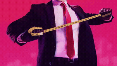 Man In Suit Measuring Chest With Yellow Tape Measure GIF