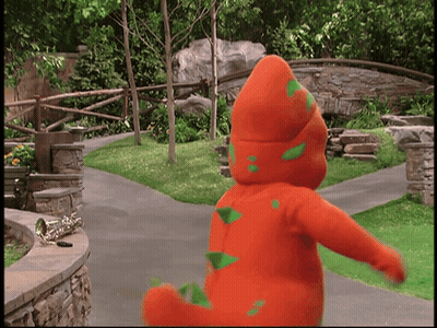 Man In Suit Next To Boy In Striped Vest In Crowd GIF