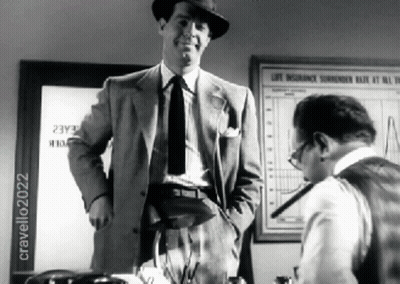 Man In Suit Next To Man At Life Insurance Surrender Rate Sign GIF