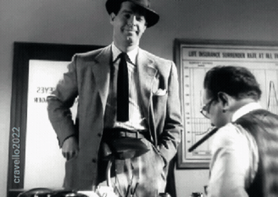 Man In Suit Next To Man In Front Of Life Insurance Surrender Rate Sign GIF