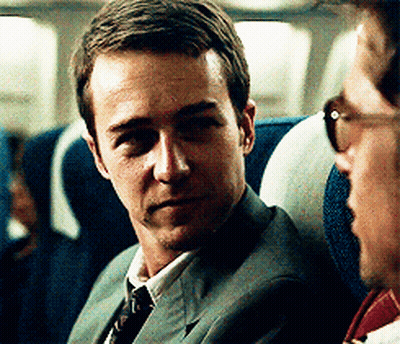 Man In Suit Next To Man In Sunglasses GIF