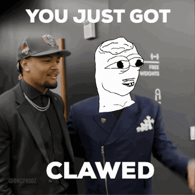 Man In Suit Next To Man Saying You Just Got Clawed GIF