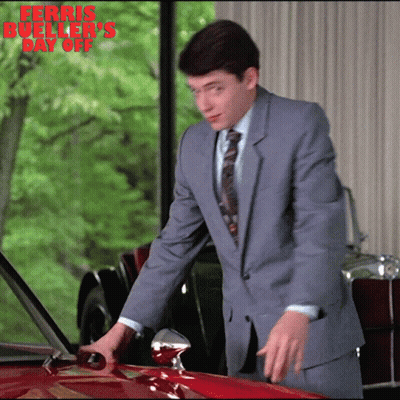 Man In Suit Next To Red Car Ferris Bueller's Day Off GIF