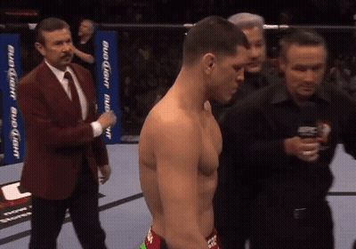 Man In Suit Next To Shirtless Man GIF