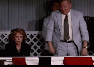 Man In Suit Next To Woman In Black Dress GIF