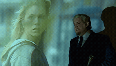 Man In Suit Next To Woman In Hoodie GIF