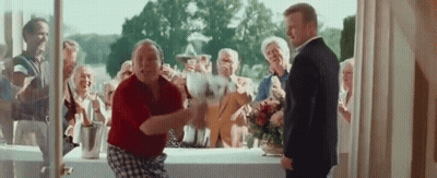 Man In Suit Next To Woman In Red Shirt Dancing GIF
