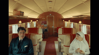 Man In Suit Next To Woman In White Dress GIF