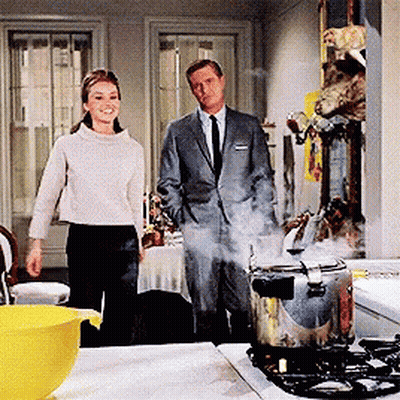 Man In Suit Next To Woman In White Sweater GIF
