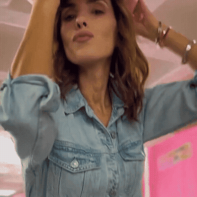 Man In Suit Next To Woman With Glasses GIF