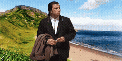 Man In Suit On Beach With Mountain GIF