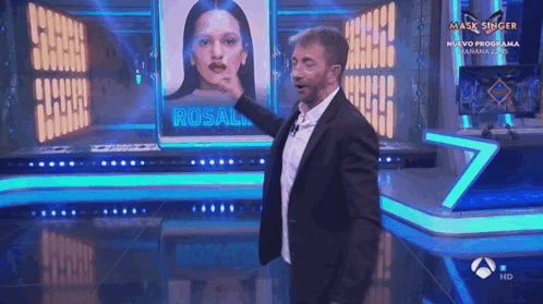 Man In Suit On Mask Singer Stage GIF