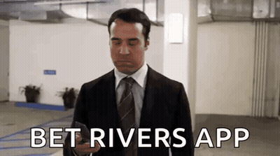 Man In Suit On Phone In Parking Garage GIF