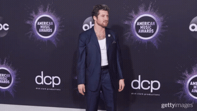 Man In Suit On Purple Carpet DCP GIF