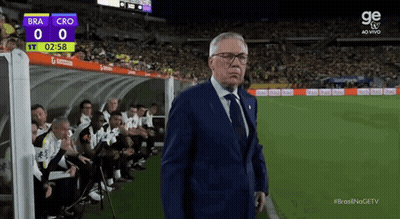Man In Suit On Soccer Field Scoreboard Bra 0 Cro 0 GIF