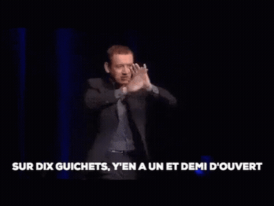 Man In Suit On Stage Arms Outstretched GIF