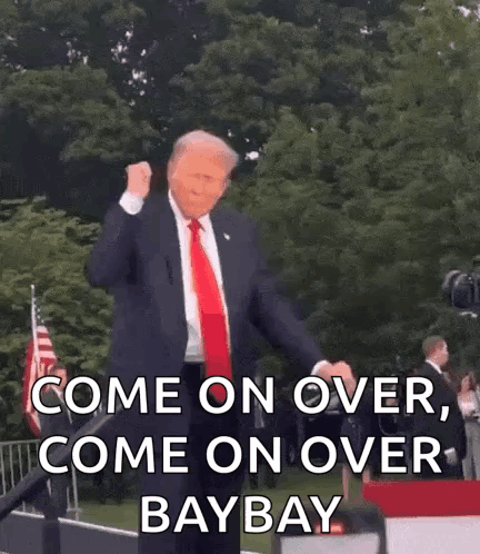 Man In Suit On Stage With Fist In Air Saying Come On Over Baybay GIF