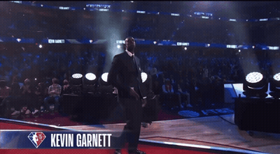 Man In Suit On Stage With Kevin Garnett GIF
