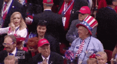 Man In Suit On Stage With Live Air Sign GIF