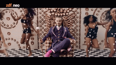 Man In Suit On Throne Surrounded By Dancing Women ZDF Neo GIF
