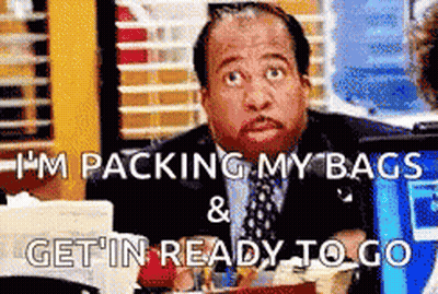 Man In Suit Packing Bags Ready To Go GIF