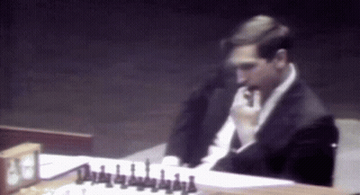 Man In Suit Playing Chess GIF