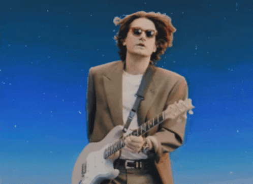 Man In Suit Playing Guitar Blue Sky GIF