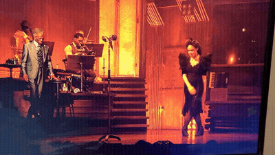 Man In Suit Playing Piano Woman In Black Dress Dancing GIF