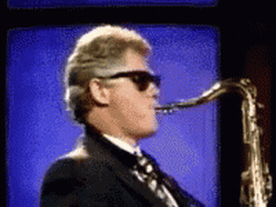 Man in Suit Playing Saxophone