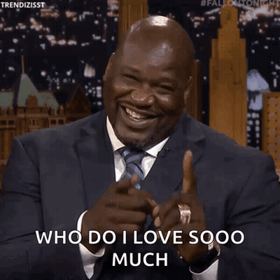 Man In Suit Pointing And Saying Who Do I Love Sooo Much GIF