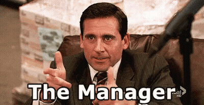 Man In Suit Pointing At Camera Saying The Manager GIF