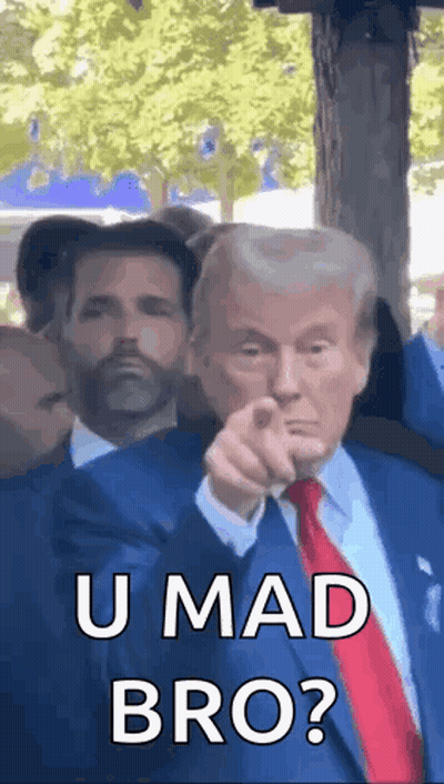 Man In Suit Pointing At Camera With Another Man Looking On GIF