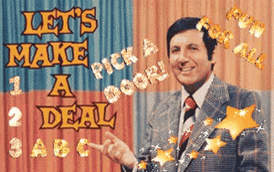 Man In Suit Pointing At Let's Make A Deal Sign GIF