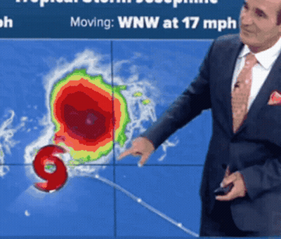 Man In Suit Pointing At Map Saying Moving Wnw 17 Mph GIF