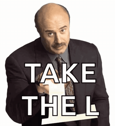 Man In Suit Pointing At Sign Saying Take The L GIF