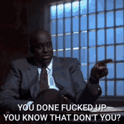 Man In Suit Pointing At Window GIF