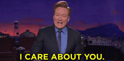 Man In Suit Pointing I Care About You GIF